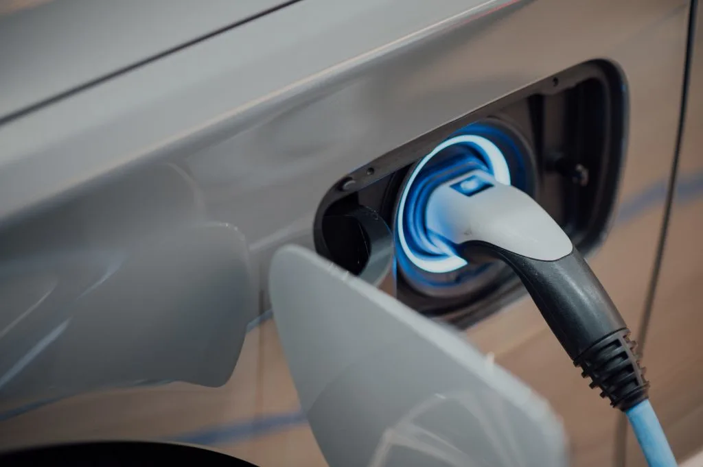 Electric charging plug connected to a car