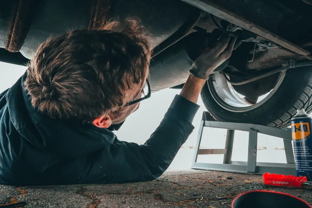 Man repairing a car