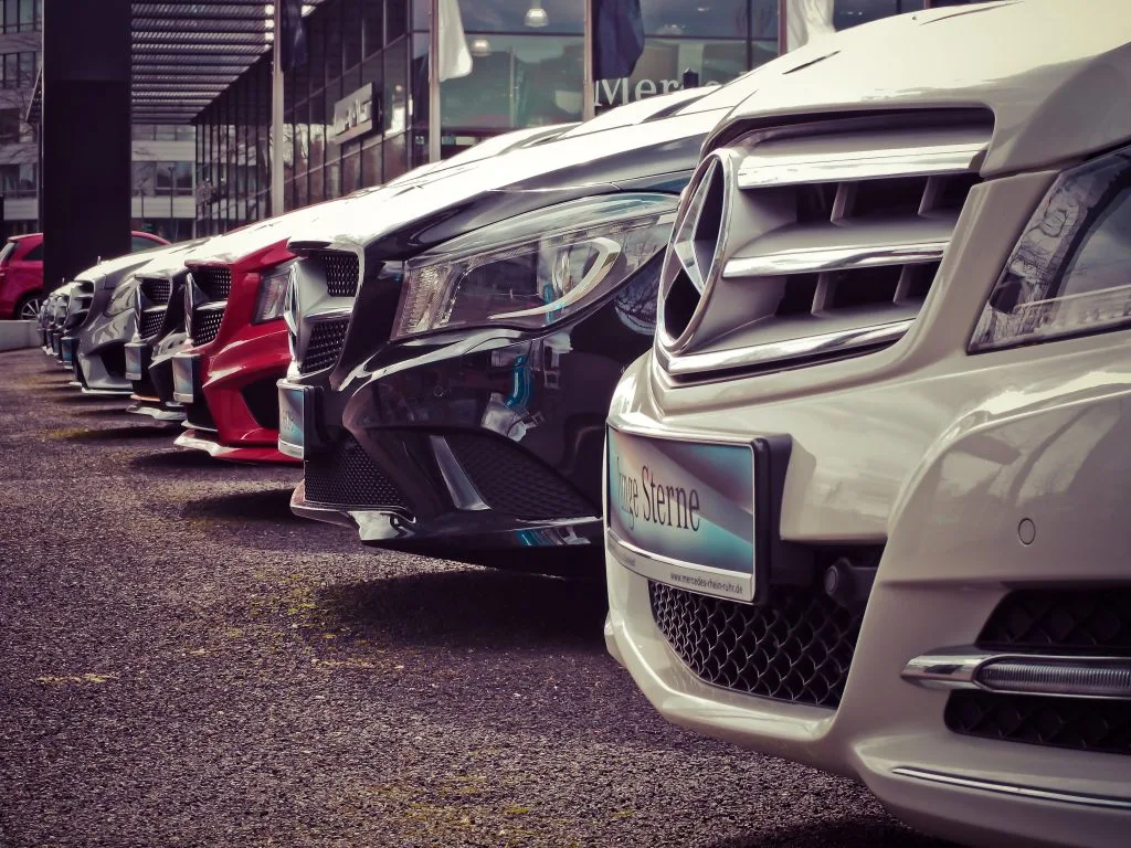 Mercedes Benz cars parked