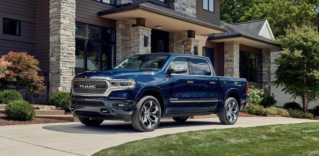 The 2023 Ram 1500 parked in a front yard