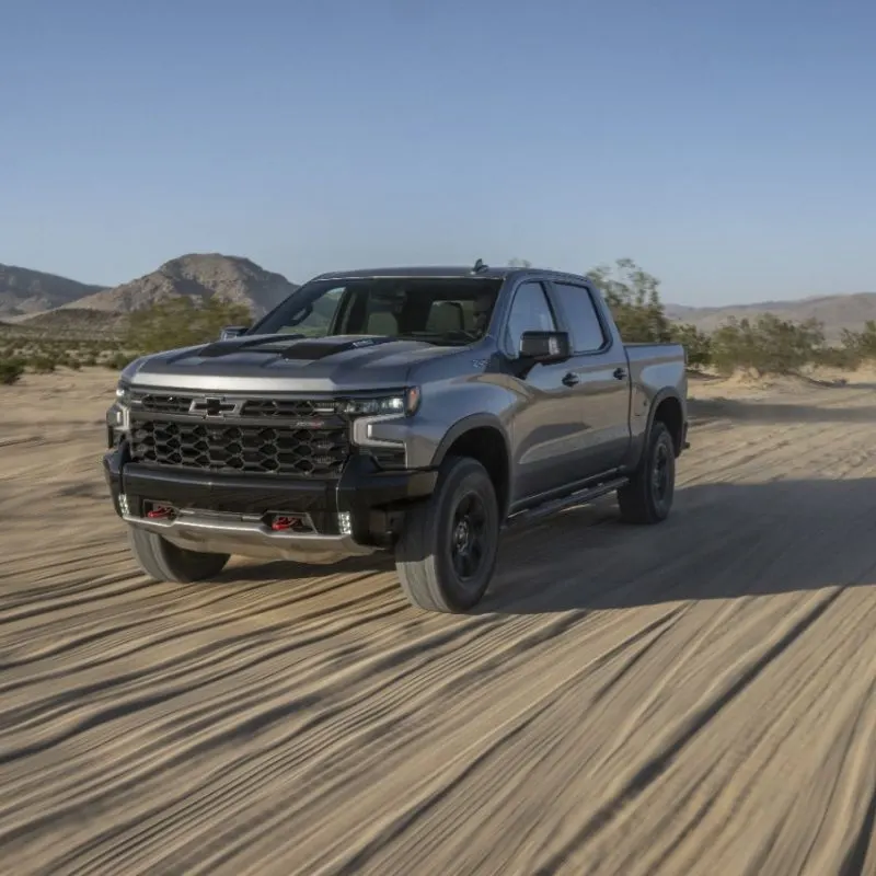 The 2024 Silverado ZR2 in motion driving through the desert