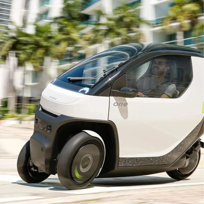 2024 Nimbus One - EV with 3 wheels driving down the road