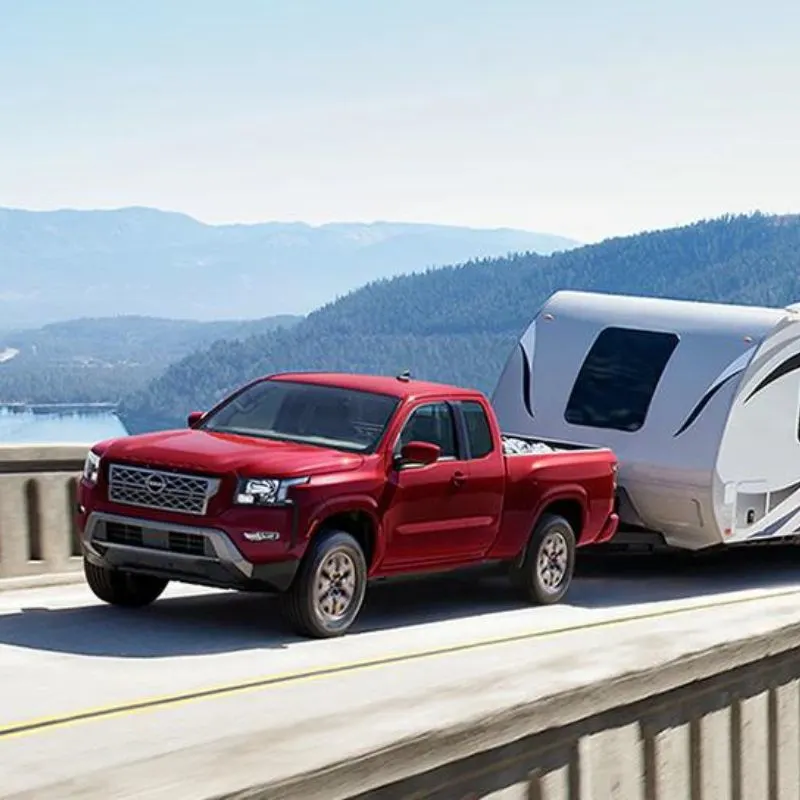 2024 Nissan Frontier - Red King Cab Towing an RV
