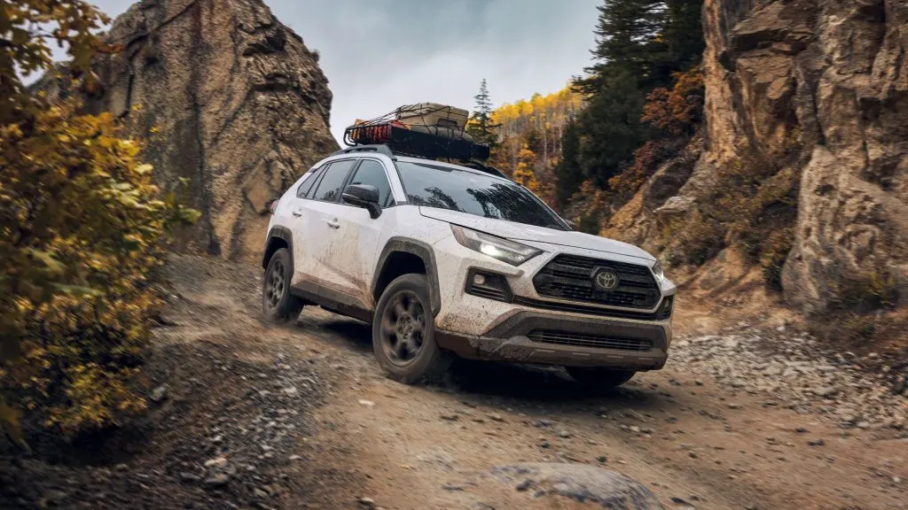 The 2023 Toyota Rav 4 white color in motion off road