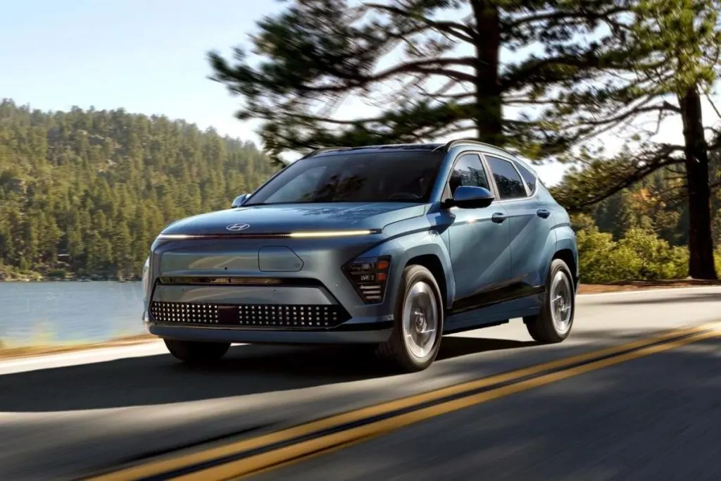 2024 Kona EV - Blue EV driving on a highway