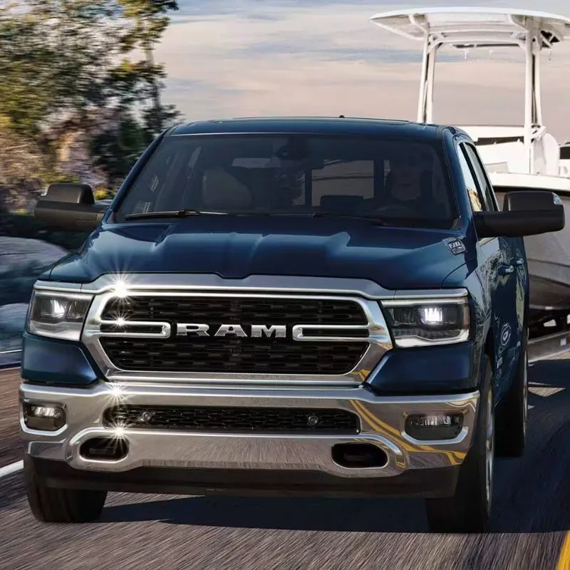 2024 Dodge Ram 1500 - Blue truck (frontal view) on the road