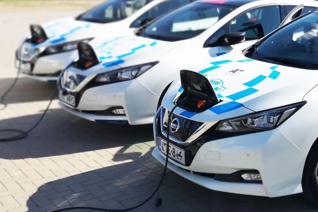 A Fleet Of Nissan Leaf Cars Charging. An EV Model Under ,000 Ranked By Experts As One Of The Best Electric Cars In The Market